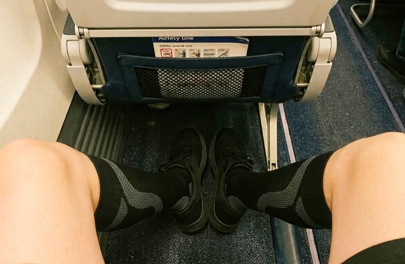 Neo-G compression socks worn on a plane during a long-haul flight